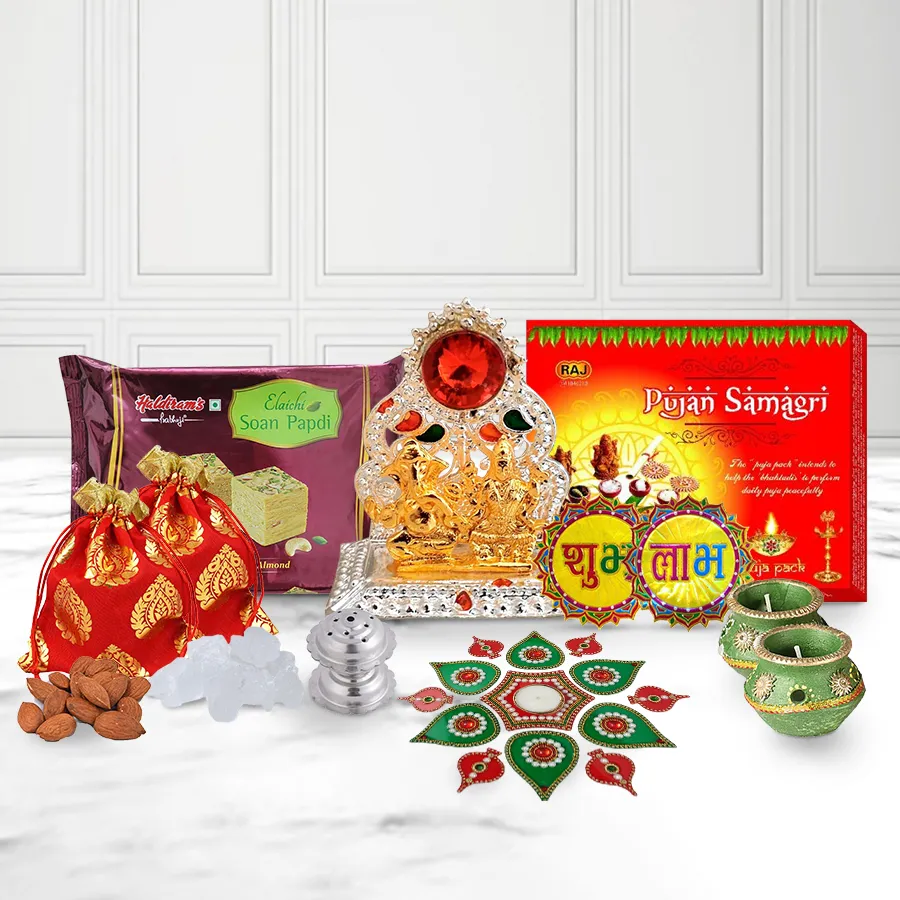 Classy Diwali decorative gift featuring Ganesh Lakshmi Mandap, wax diyas, acrylic rangoli set, puja samagri, Haldiram Soan Papdi, almond mishri, doop box, Subh Labh sticker, and stylish gift box.