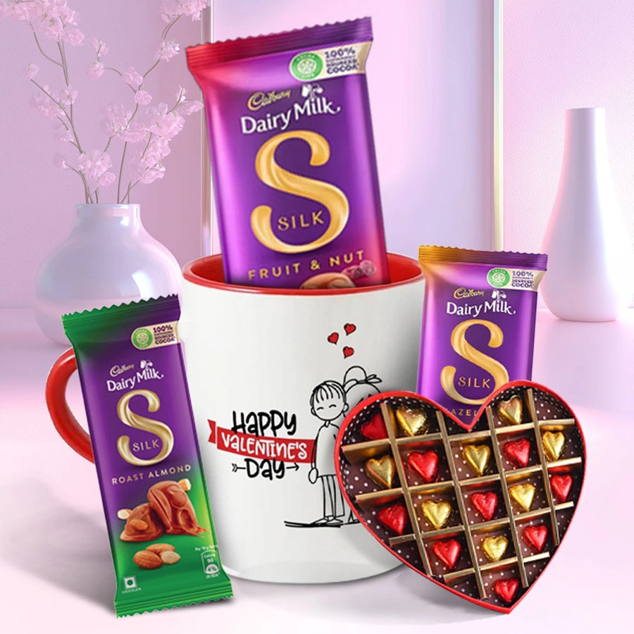 Love Supremacy Chocolate Assortment with ceramic mug featuring heart-shaped chocolates and an engraved message for Valentine's Day.
