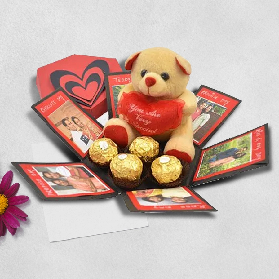 Personalized hexagonal explosion box containing Ferrero Rocher chocolates and a teddy bear, featuring space for photos and messages.