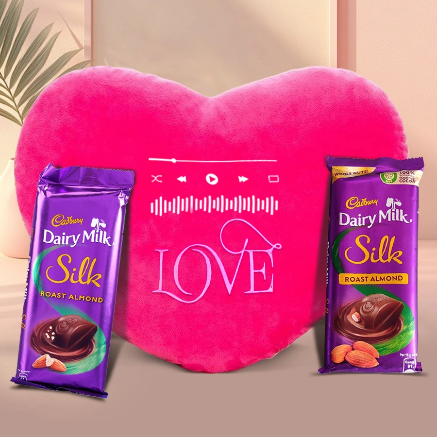 Heart-shaped musical cushion with Cadbury Dairy Milk Silk chocolates for Valentine's Day gift.