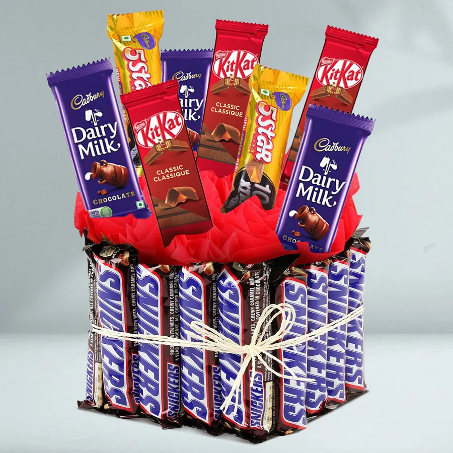 A beautiful vase filled with branded chocolates, including Snickers, Cadbury Dairy Milk, Nestle KitKat, and Cadbury Five Star, arranged elegantly for Valentine's Day.