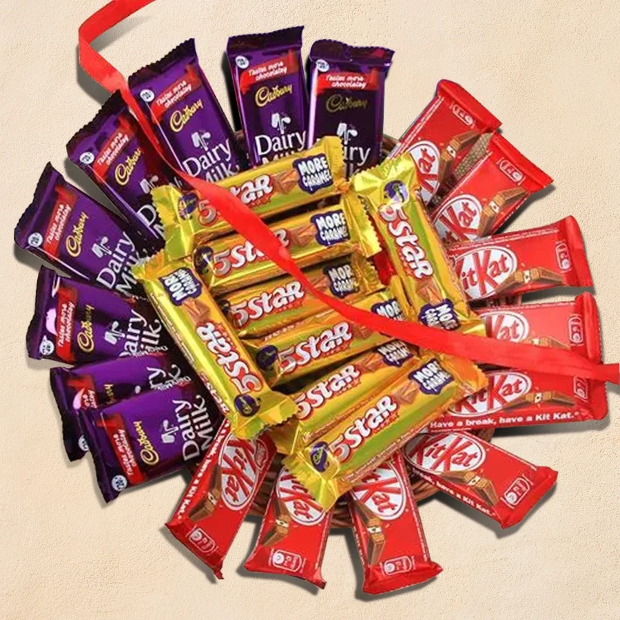 Magical Chocolate Day Platter featuring Cadbury Dairy Milk bars, Nestle Kitkat Wafer Cocoa pieces, and Cadbury 5 Star chocolates arranged in a charming cane basket