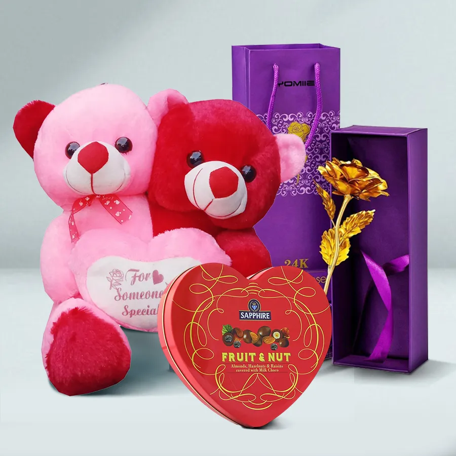Twin Combo Teddy set featuring two 9-inch teddies, three boxes of Sapphire Hazelfills Chocolate Hearts, and a Golden Rose.