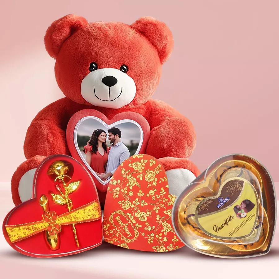 Personalized teddy bear with a photo, golden rose in a heart-shaped box, and three Sapphire Hallefills chocolates.
