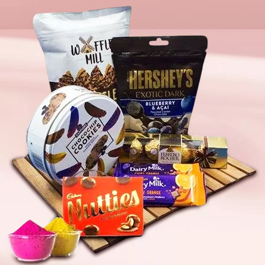 Tasty assorted chocolates hamper with free colorful gulal for Holi celebration