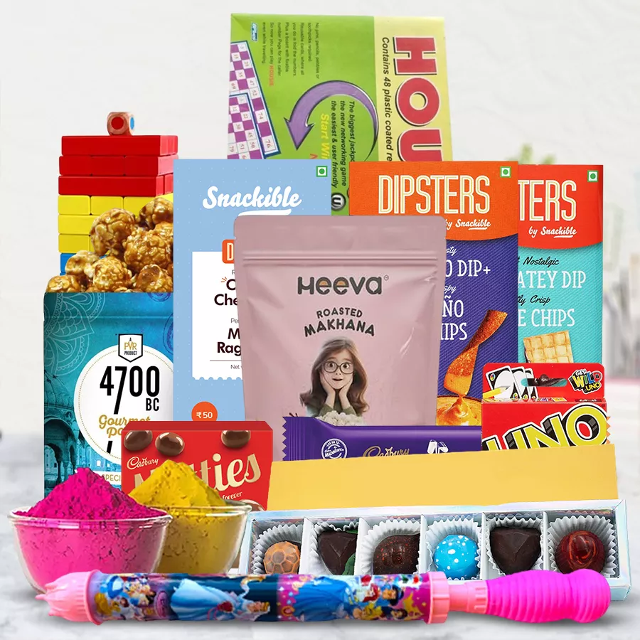 Holi Evening Party Hamper with treats, games, herbal gulal, and a Pitchkari in a wooden tray