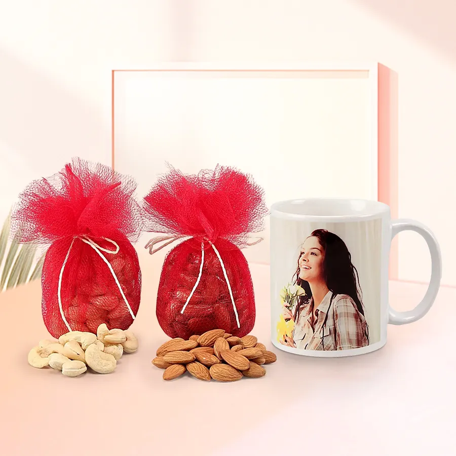 Personalized white mug alongside a package of premium almonds and cashews.