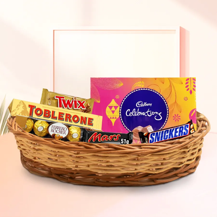 Amazing Chocolate Gift Basket filled with Toblerone, Ferrero Rocher, Snickers, Twix, Mars, and Cadbury Celebration, beautifully presented in a charming basket.