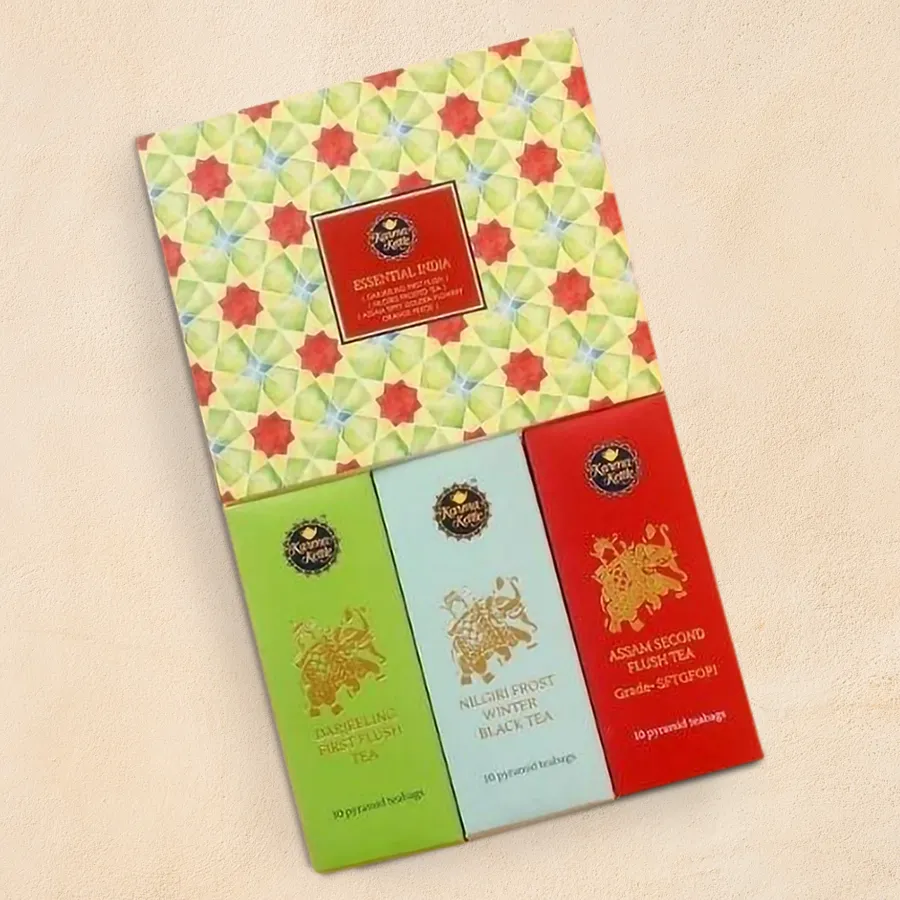 Assorted Indian Tea Gift Set with elegant pyramid teabags of Assam Second Flush, Darjeeling First Flush, and Nilgiri Winter Frost in a decorative hamper.