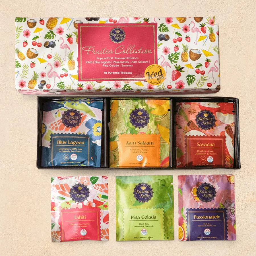 Colorful assortment of six fruity tea blends in vibrant packaging, showcasing flavors like Pina Colada, Savanna Rooibos, and Passionfruit.