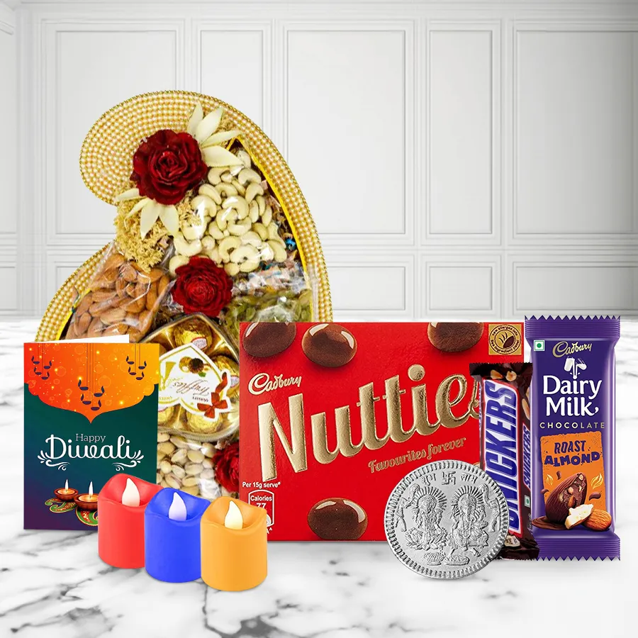 Ecstatic Dry Fruits and Chocolates Overloaded Tray for Diwali with cashews, raisins, almonds, pistachios, assorted chocolates, tea light candles, and a silver-plated Ganesh-Laxmi coin.