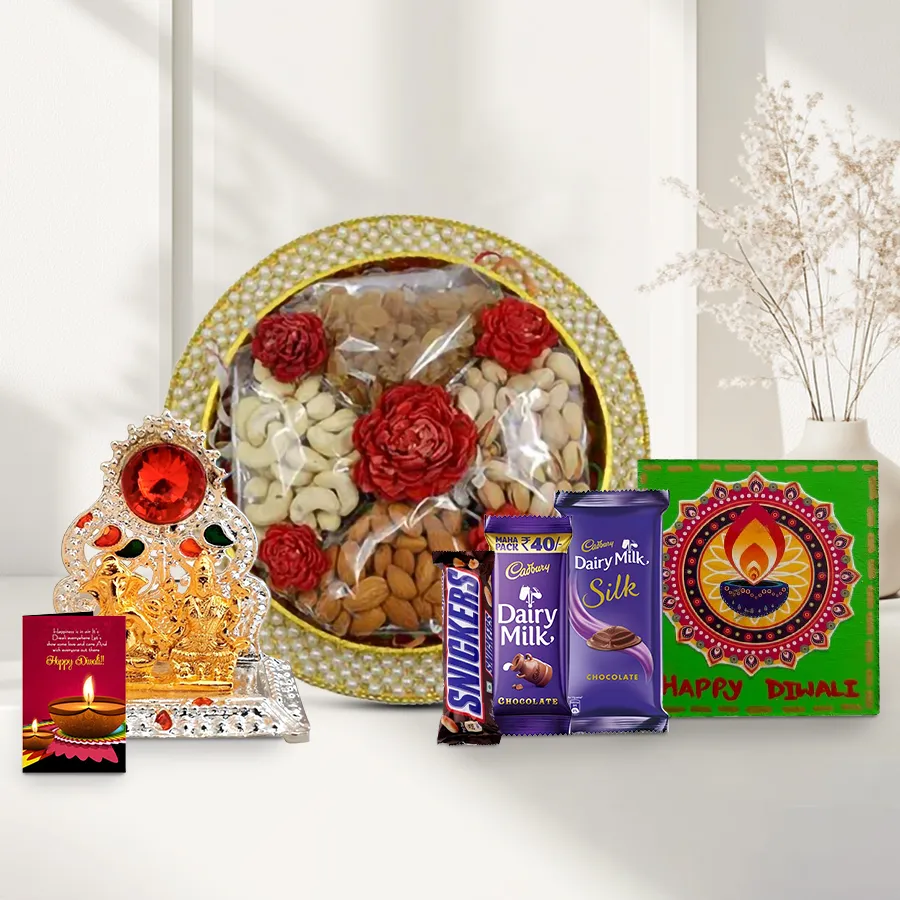 Ravishing gift combo featuring dry fruits, chocolates, a Ganesh Lakshmi Mandap, a handmade fridge magnet, and a Diwali greeting card.