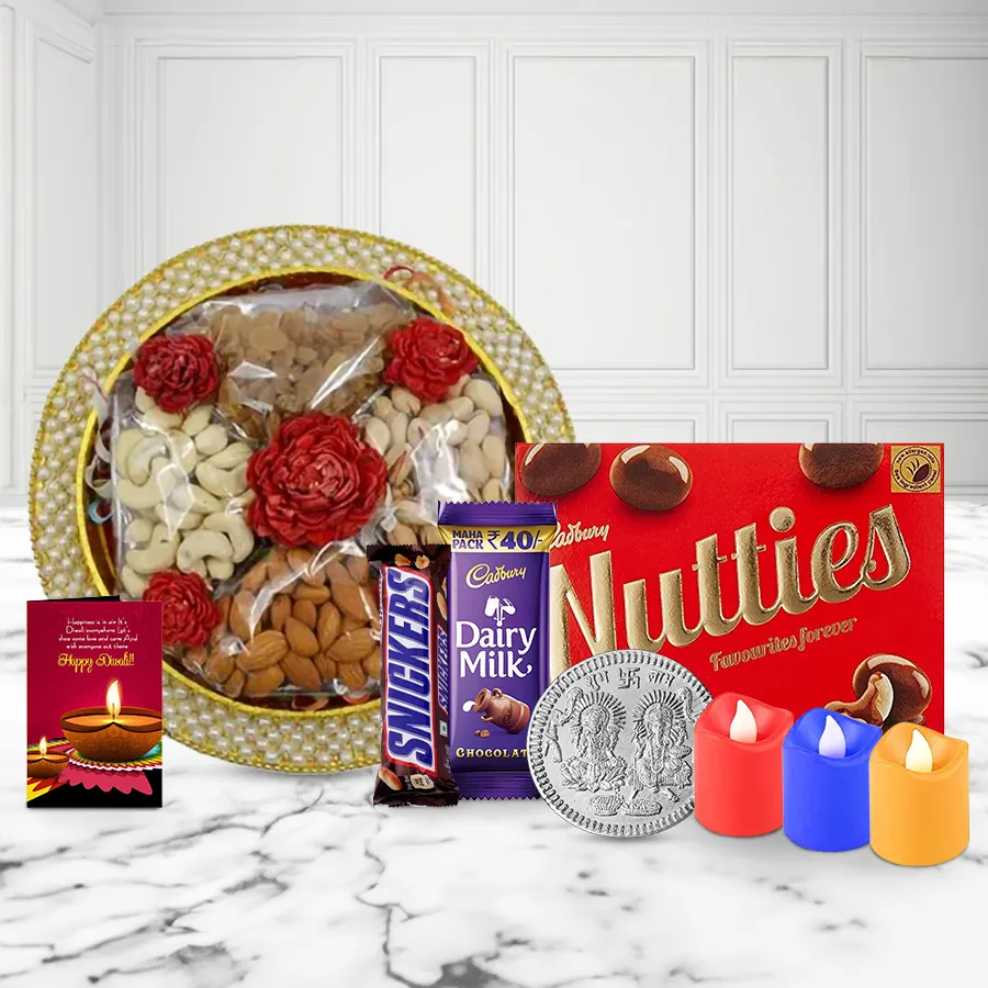 Festive Assorted Gift Box featuring premium nuts, chocolates, tea light candles, and a silver-plated Ganesh Lakshmi coin, accompanied by a Diwali Wishing Card.