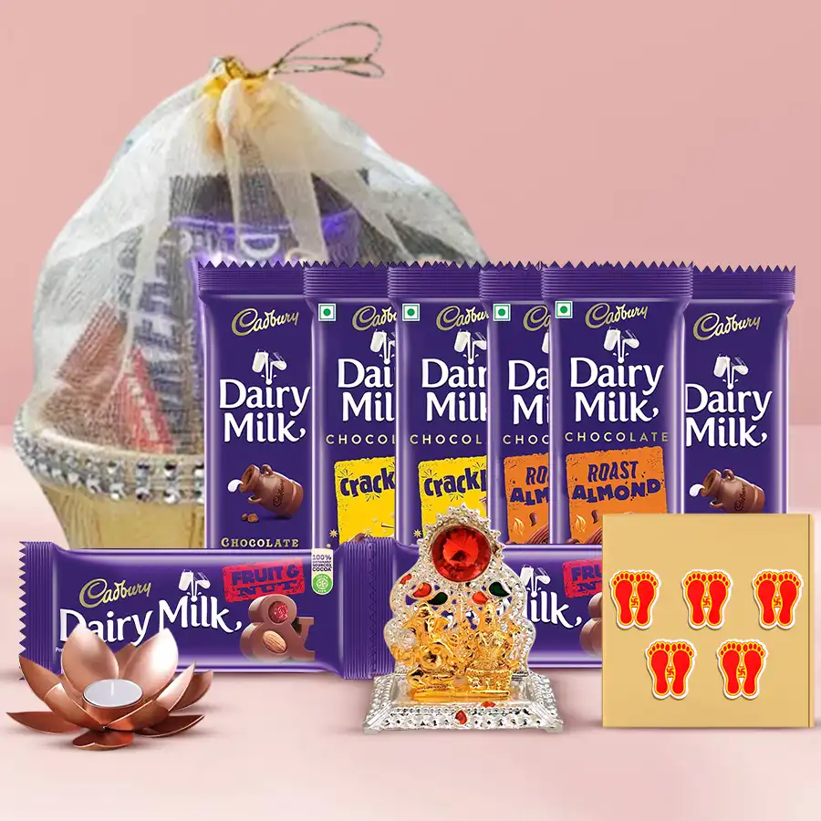 Chocolaty Diwali Hamper featuring Cadbury chocolates, Ganesh Laxmi Mandap, tea light candle holders, decorative stickers, and a gift basket in a festive arrangement.