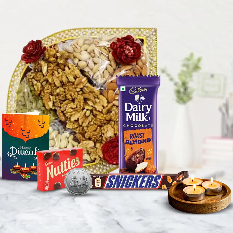 Fusion Diwali Treat Hamper featuring a pearl tray with premium nuts and raisins, Cadbury Dairy Milk Roast Almond, Snickers, Cadbury Nutties, tea light candles, a silver-plated Ganesh Laxmi coin, and a Diwali wishing card.