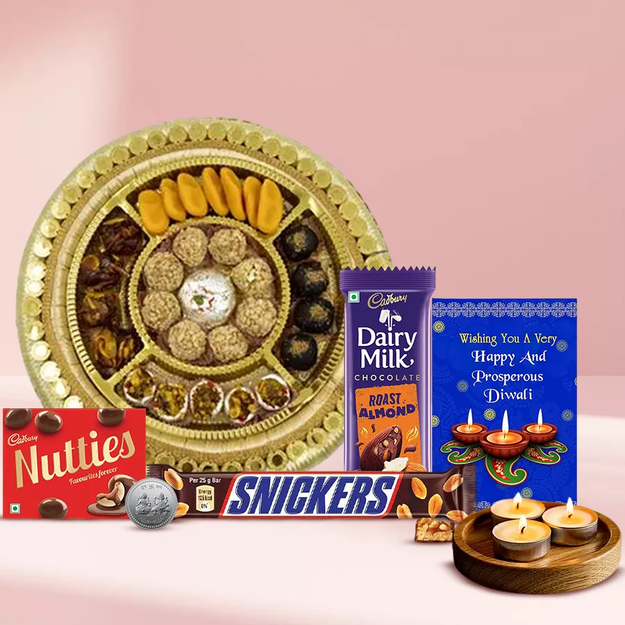 Happy Moment Diwali Hamper featuring sweets, chocolates, tea light candles, a silver-plated Ganesh Laxmi coin, and a Diwali card.