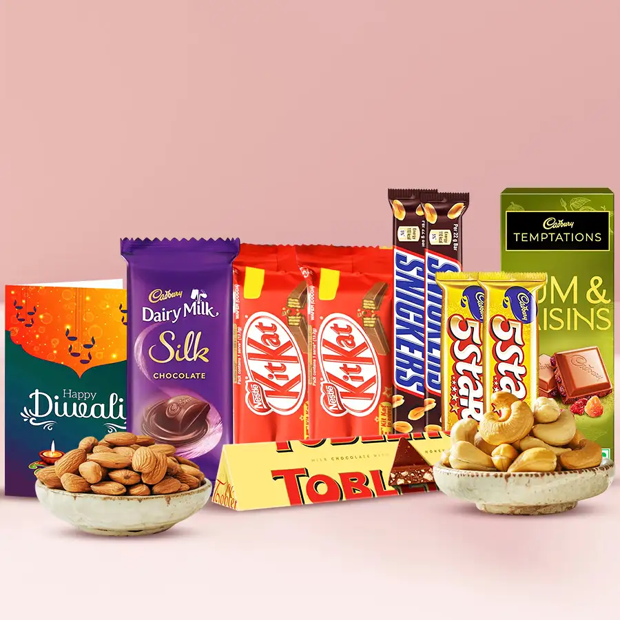 Chocolaty Confections Diwali Gift Hamper featuring Toblerone, Nestle Kit Kats, Snickers, Cadbury 5-Star, Cadbury Silk, Rum & Raisin, almonds, cashews, and a Diwali wishing card.