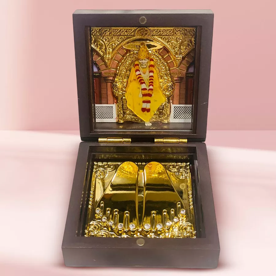 Divine Shirdi Saibaba Charan Paduka Gift Box in vibrant colors displayed on a surface.