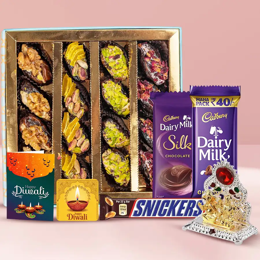 Finest Dates Baklava N Chocolaty Escapade hamper with dates baklava, Cadbury Silk, Dairy Milk, Snickers chocolates, Ganesh Laxmi Mandap, handmade fridge magnet, and Diwali card.