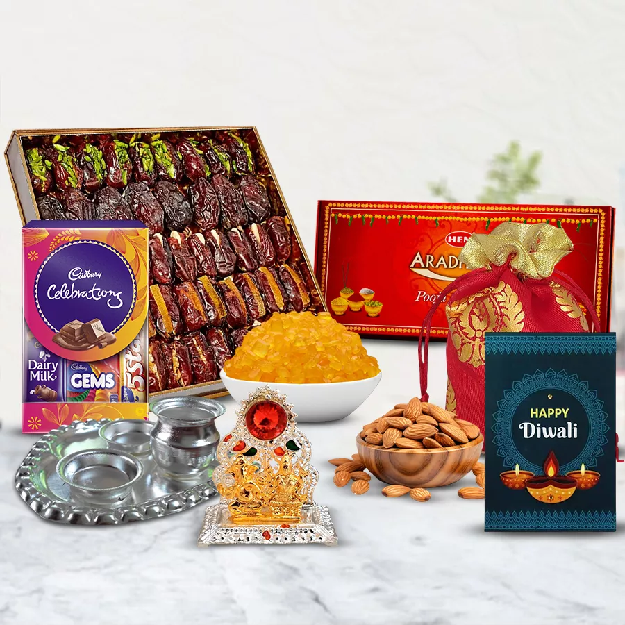 Tasteful Dates Baklava with Chocolate Bursts gift box featuring assorted sweets, pooja items, and a Diwali card.
