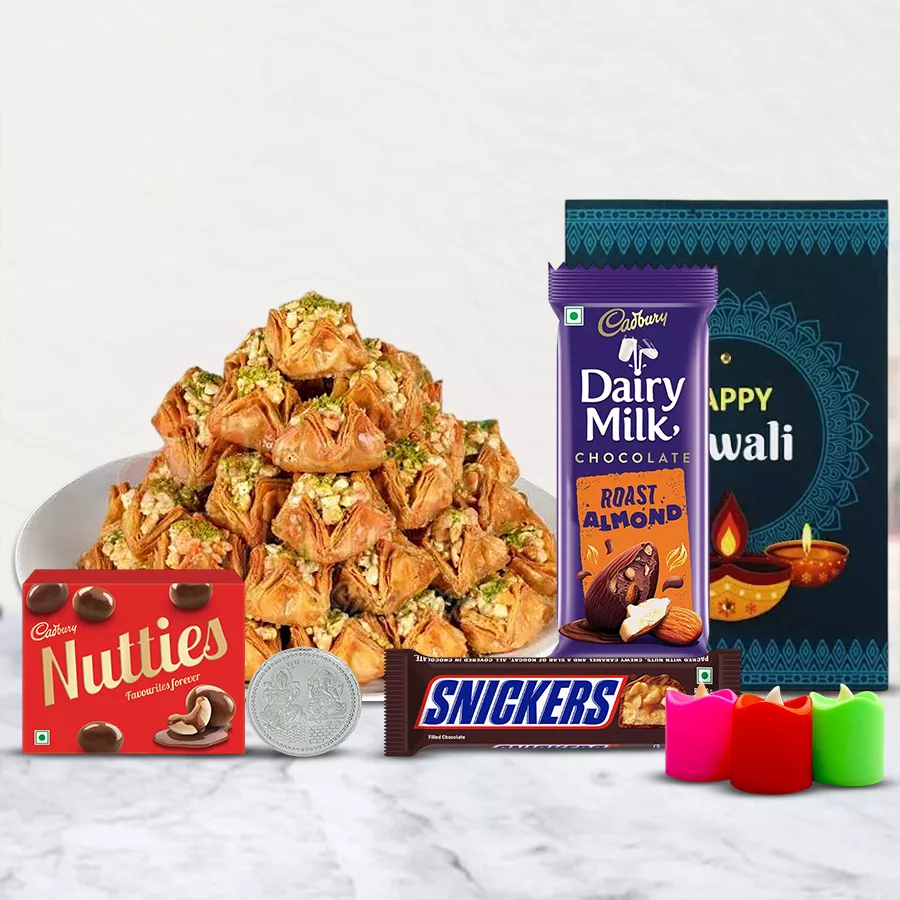 Sheer Bliss Pyramid Baklava gift box featuring Pyramid Baklava, Cadbury chocolates, tea light candles, a silver-plated Ganesh Lakshmi coin, and a Diwali card