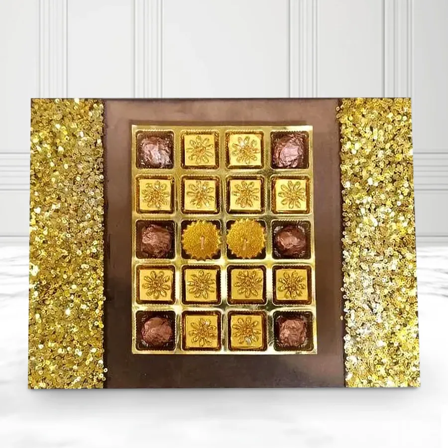 Enchanted wooden tray filled with 18 handmade dark chocolates and 2 golden diyas, perfect for Deepavali celebrations