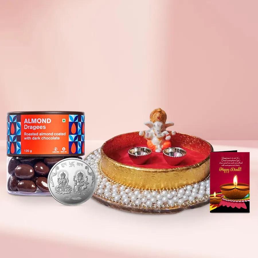 Diwali Special Almond Dragee Gift Basket with almond dragees, pearl puja thali, Ganesh idol, silver-plated Ganesh Lakshmi coin, and Diwali card
