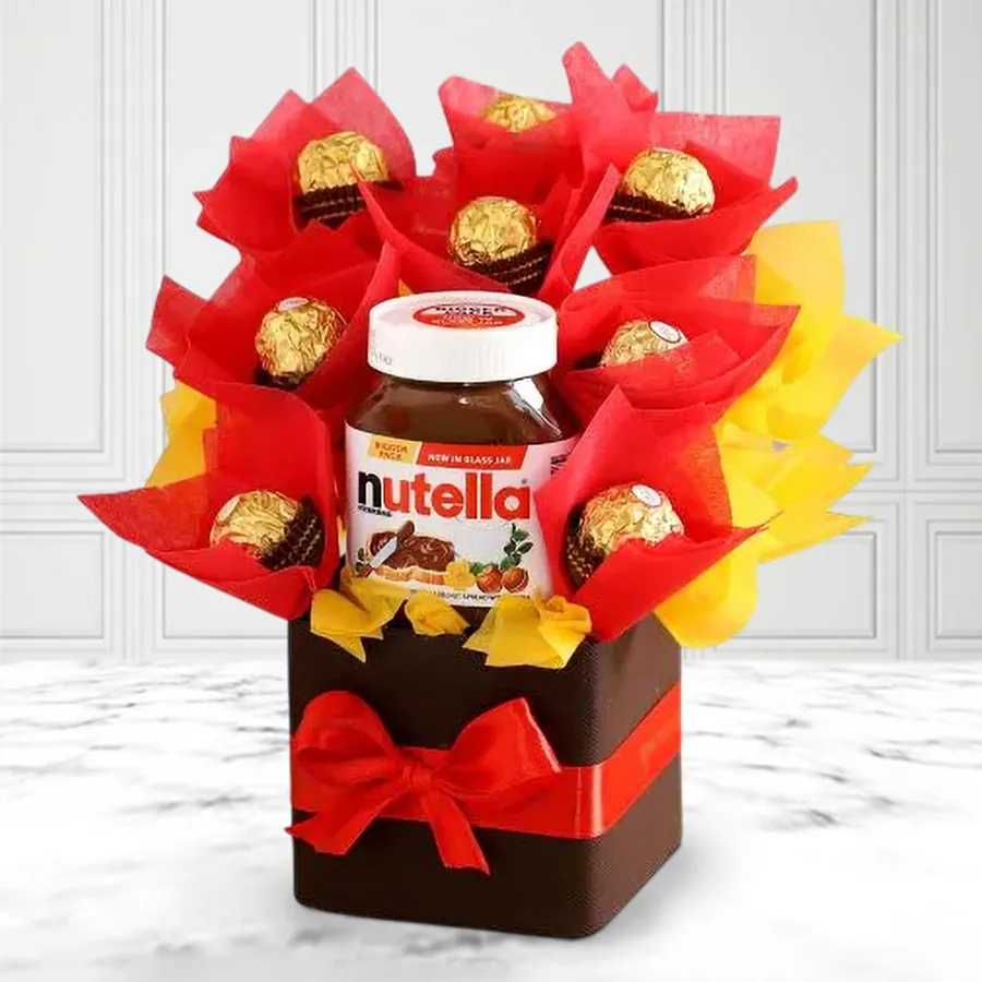 Feisty Ferrero Rocher Christmas Arrangement featuring a 180g jar of Nutella and eight Ferrero Rocher chocolates beautifully packaged for the holiday season