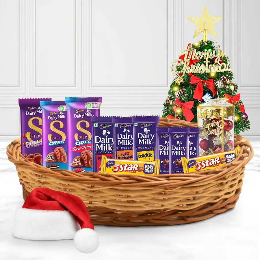 Everlasting X-Mas Memoir Basket filled with Cadbury Silk and Dairy Milk chocolates, festive decorations, and a Christmas tree topper in a reusable basket.