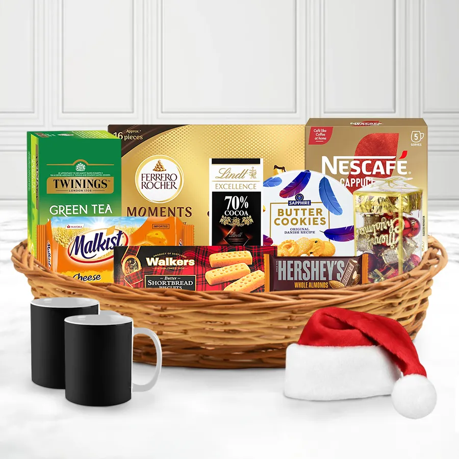 Soulful X-Mas Treat Gourmet Basket filled with premium cookies, dark chocolate, teas, cappuccino, Ferrero Rocher, coffee mugs, and festive decorations.