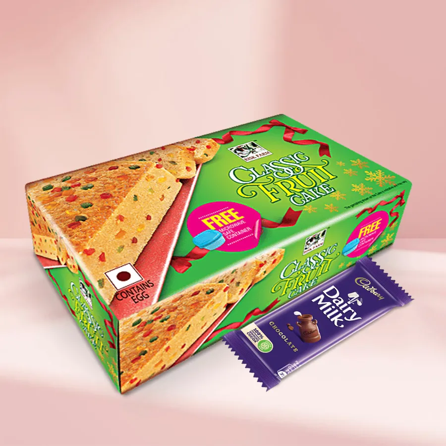 Personalized Christmas wrap featuring Cadbury Dairy Milk bars and a fruit cake, decorated with festive elements.