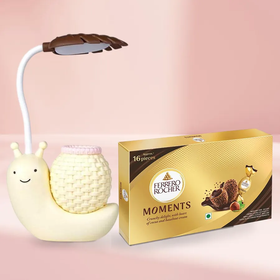Wonderful combo of Ferrero Rocher chocolates and a snail table lamp cum pen stand