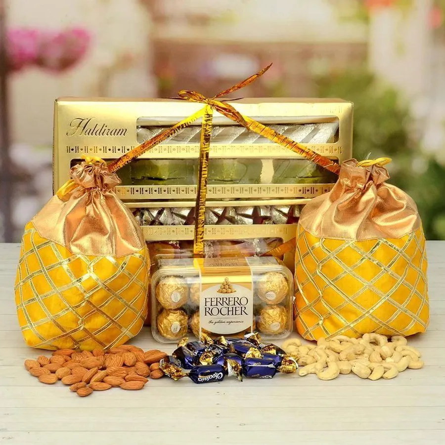 Haldiram Sweets basket with Ferrero Rocher chocolates, nuts, and Cadbury Eclairs
