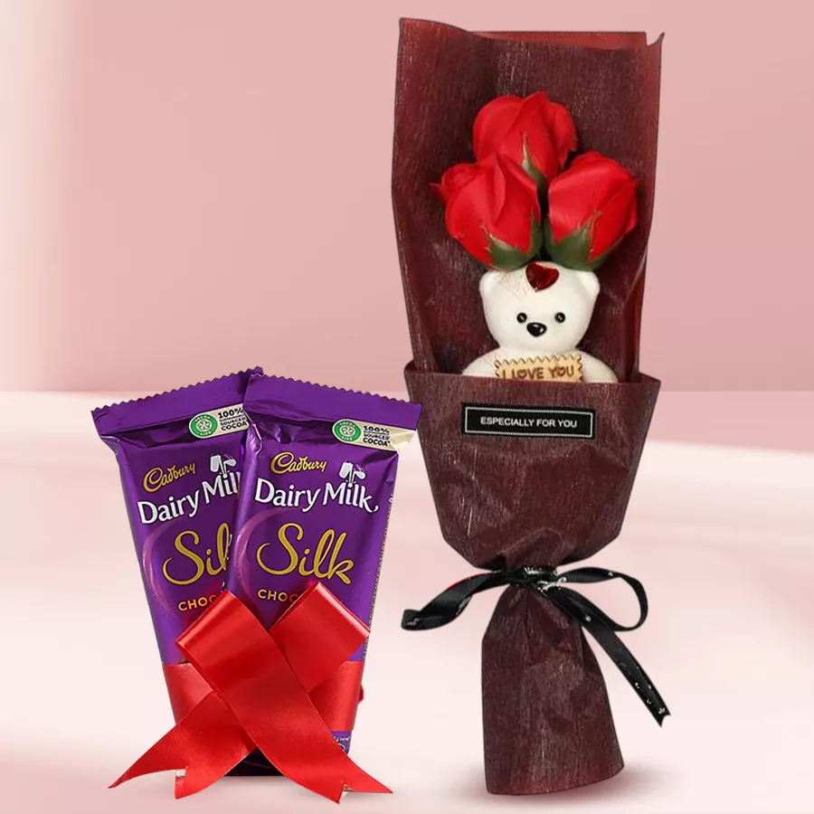 Artificial roses bouquet with Cadbury Silk bars tied with a red ribbon for Propose Day gift