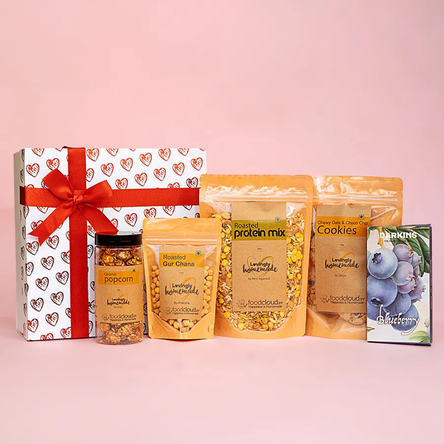 Tasty Homemade Valentine’s Surprise Treats Hamper featuring caramel popcorn, chocolate slabs, roasted protein mix, gur chana, and oats & choco chip cookies