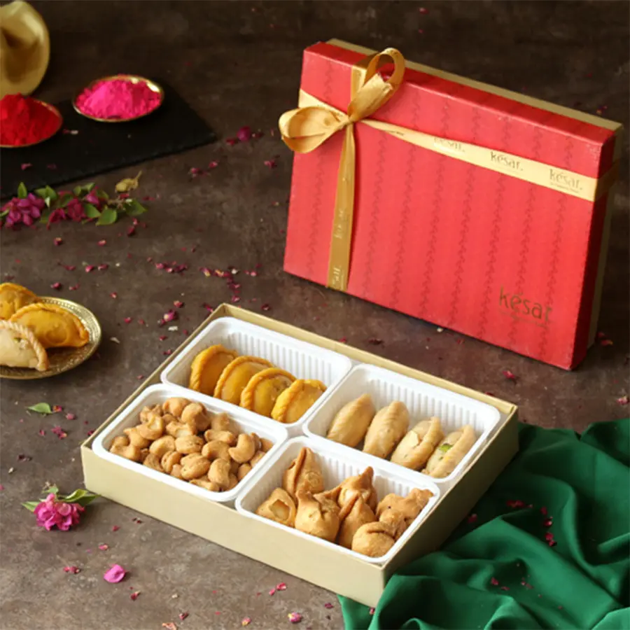Assorted Gujiya, Mini Samosas, Maida Kaju, and a Holi Greetings Card in a festive gift box