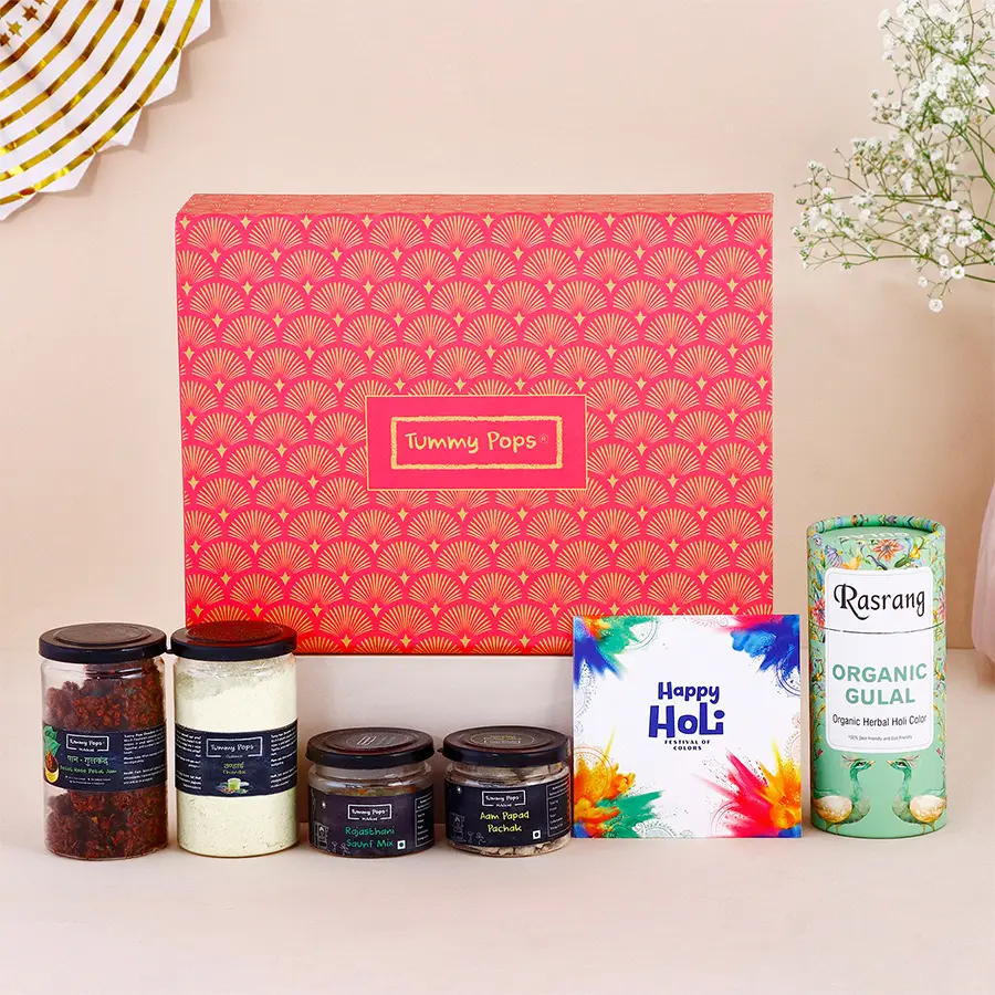 Ravishing gift box filled with assorted Holi treats including Paan Gulkand, Thandai, Mukhwas, Gulal, and a greeting card