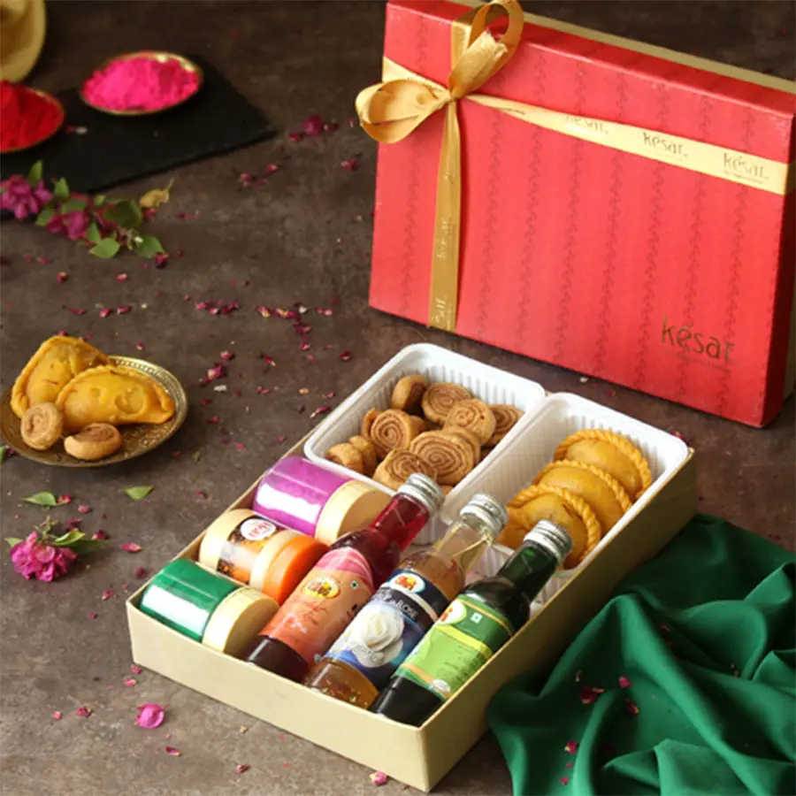 Splendid Sweet Treat with Sharbat N Organic Gulal Combo featuring Kesar Gujiya, Bhakarwadi, organic gulal, chandan, sharbat in a festive gift box with a Holi greeting card