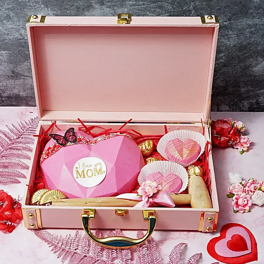 Trendy Sweetheart Mom Trunk filled with chocolate treats and cookies, including Almond Florentines, mini heart-shaped pinatas, and Chocolate Almond Rocks.