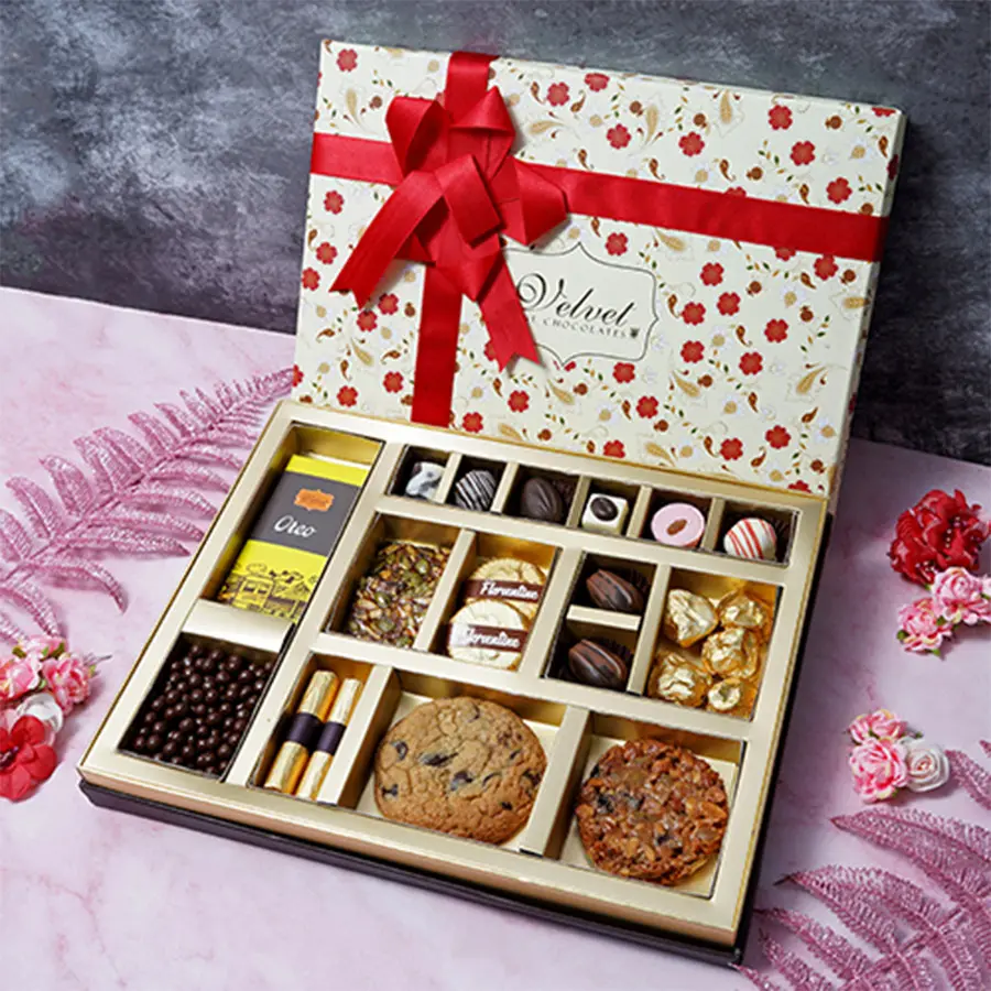 Delightful Mother's Day Sweet Choco Treat Hamper filled with chocolates, including Oreo bars, truffles, almond florentines, and chocochip cookies.