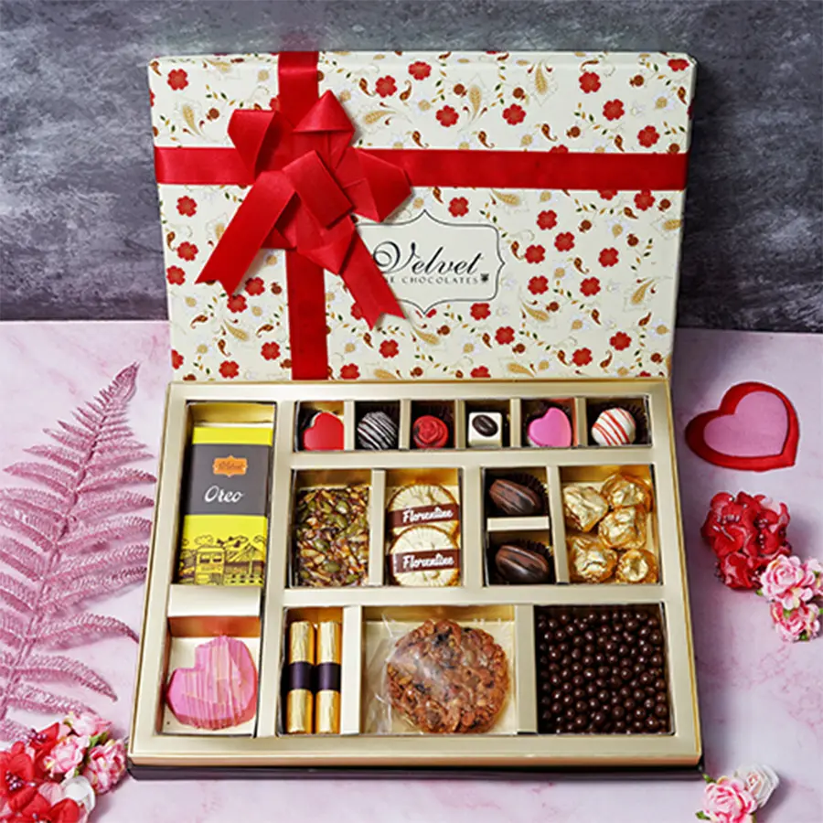 Delectable Chocolaty Pamper Hamper for Mom filled with various chocolates, cookies, and sweets.