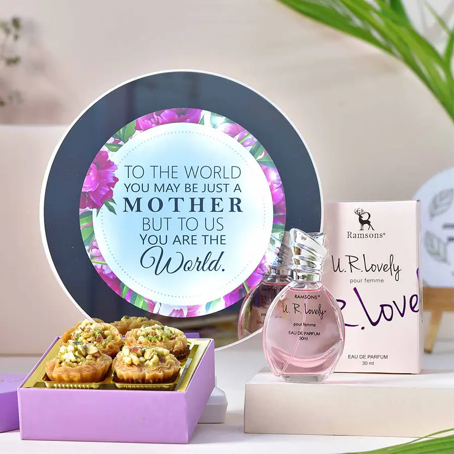 Always A Part of Me Hamper featuring MOM Magic Mirror, Ramsons Pour Femme Perfume, and Garden Bakery Tart Baklawa pieces, beautifully arranged to celebrate motherhood.