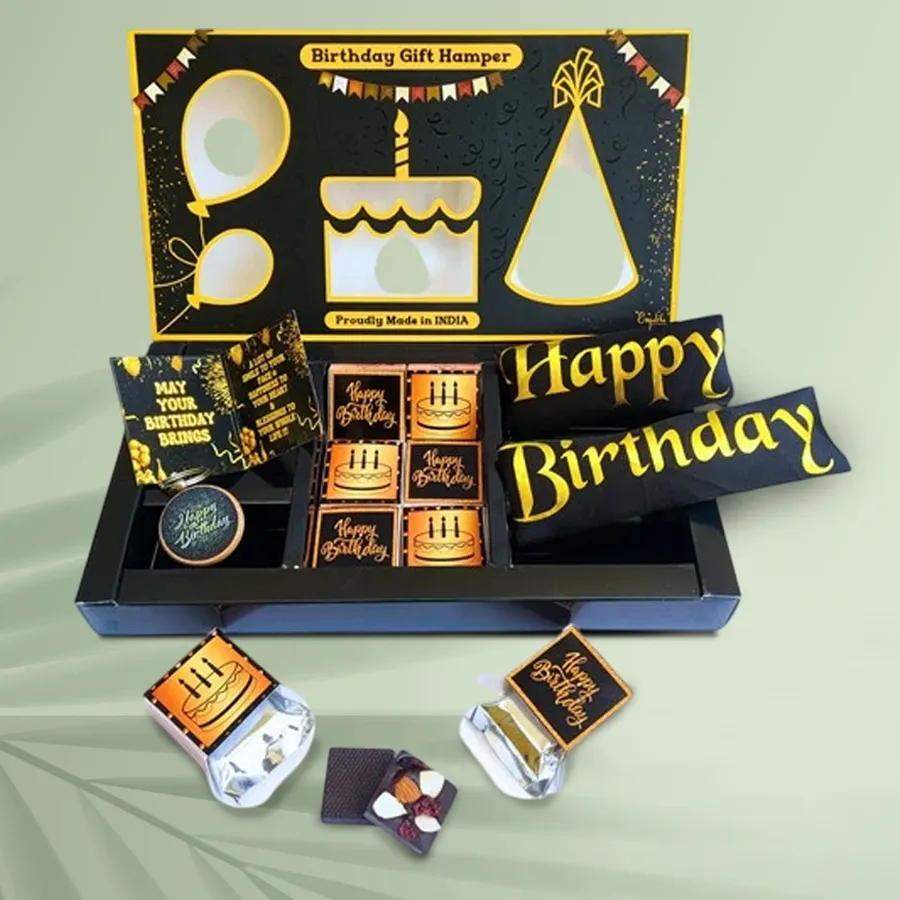 Exotic Happy Birthday Chocolate and Gift Box featuring premium chocolates, wooden keychain, golden foil birthday sash, and greeting card in a high-quality gift box.