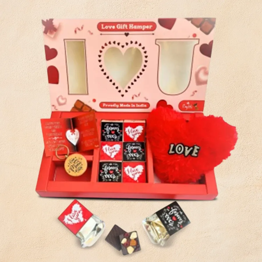 Romantic hamper featuring premium chocolates, a wooden keychain, a heart-shaped pillow, and a love greetings card, all elegantly arranged in a high-quality gift box.