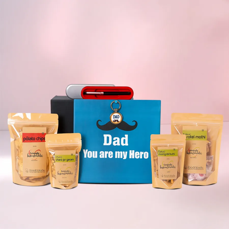 Indulgent Snacks Gift Box for Dad featuring a Parker Pen Box, Father’s Day Keychain, and a variety of snacks including Baked Moong Dal Twisty, Fiery Potato Chips, Baked Mathi, and Roasted Chana Jor Garam