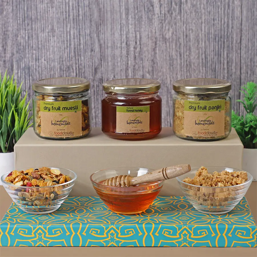 Premium Power Trio Mix Box featuring Dry Fruit Muesli, Dry Fruit Panjiri, and Natural Forest Honey packaged together for a healthy and energizing snack option.