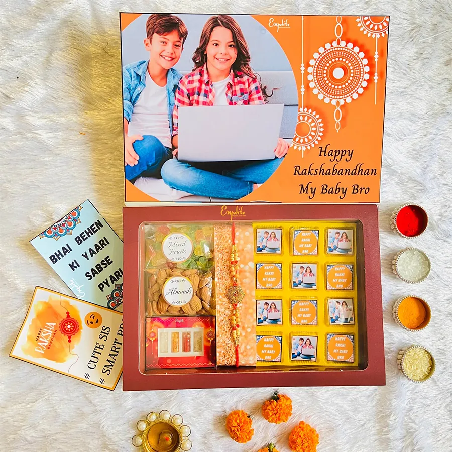 Classic Rakhi with Customized Chocolates Hamper featuring a designer metal mauli rakhi, assorted chocolates, crunchy almonds, dried mixed fruits, and a greeting card.