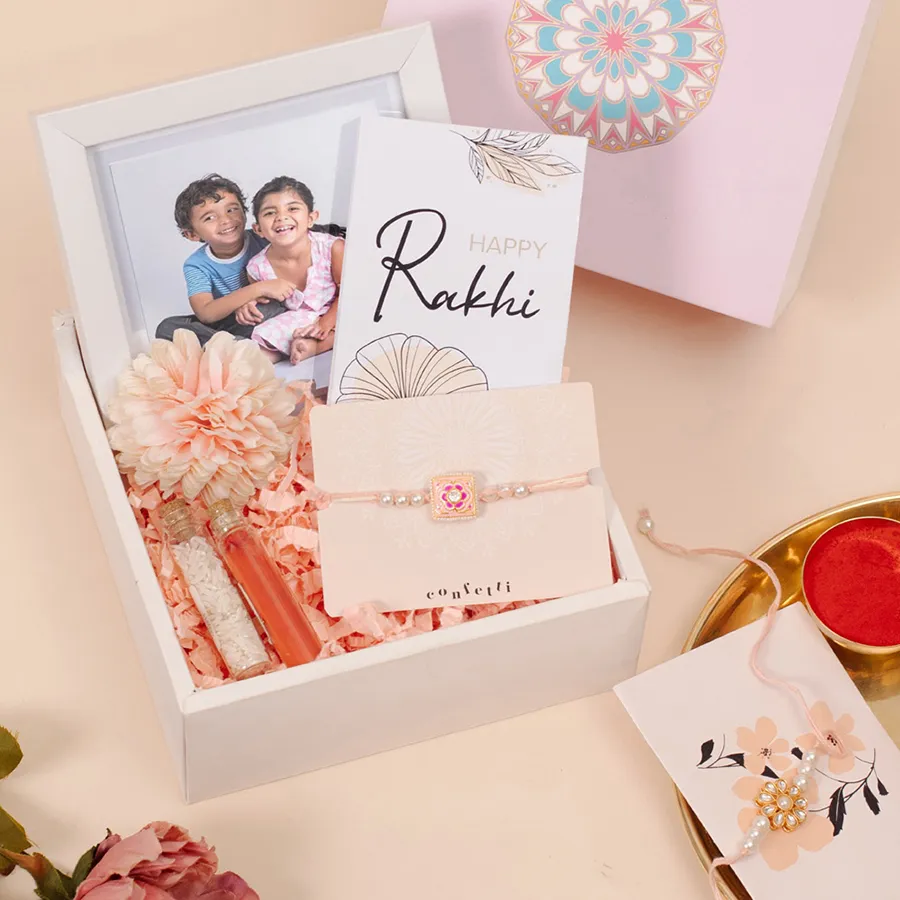 Premium Photo Frame Rakhi Hamper with personalized photo frame, chocolate bar, Kundan Rakhi, and confetti gift box
