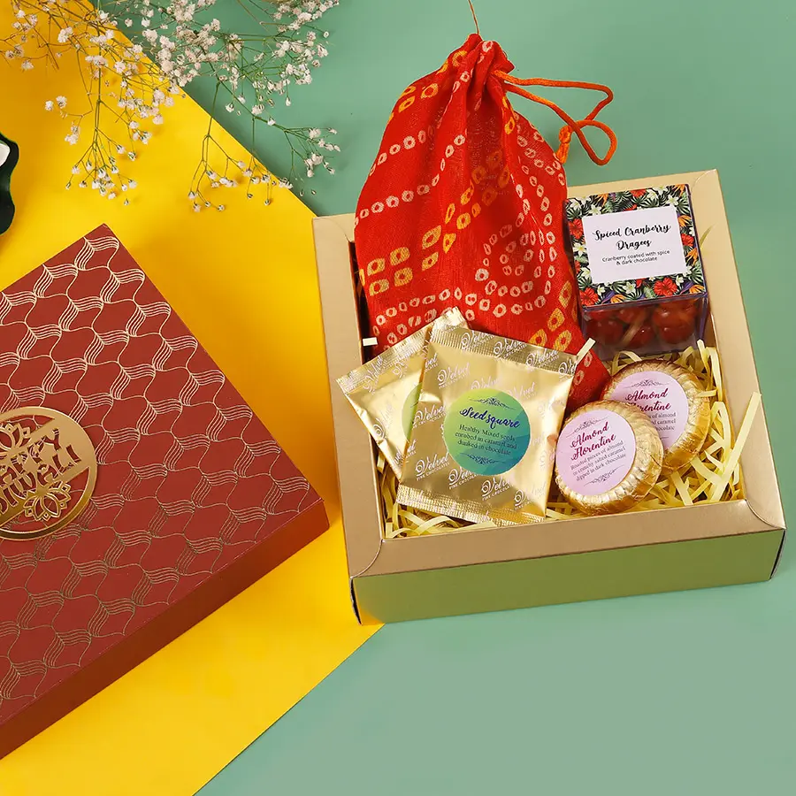 Luxurious hamper of Nutty Delights N Chocolate Medley featuring Seeds Squares, Almond Chocolate Florentines, Cranberry Dragees, and assorted chocolates.