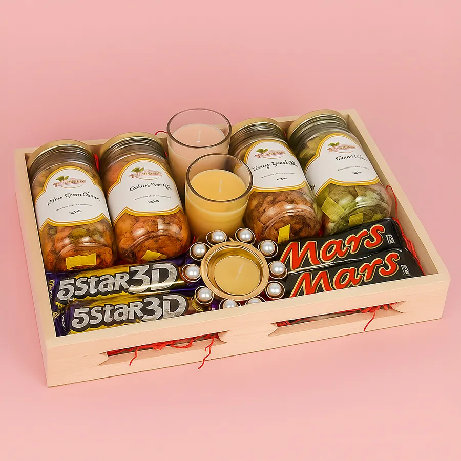 Designer wooden tray filled with assorted treats including Cashew Green Chutney, Peri Peri, Kismis Orange Chilly, Pan Flavored jars, Iris scented candles, a Pearl T Light candle, and sweet 3D 5 Star and Mars chocolates, elegantly presented for Diwali.
